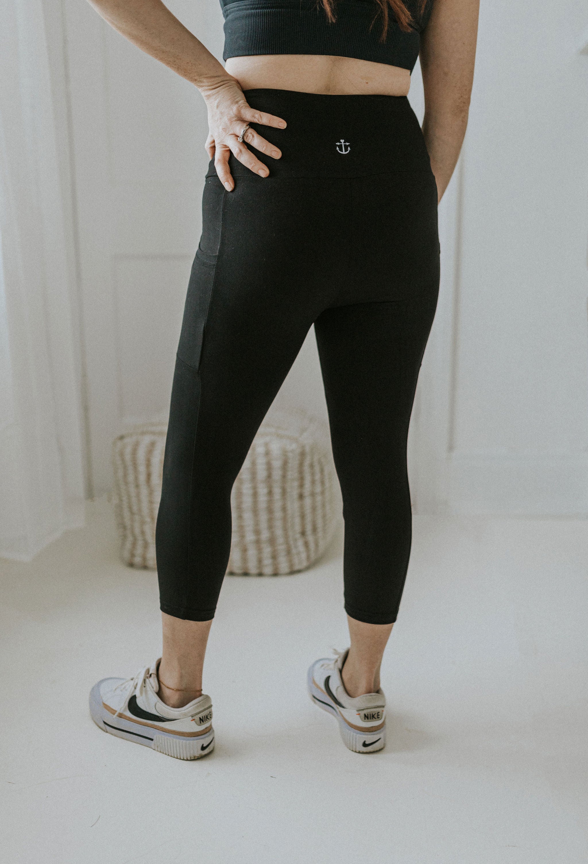 Crossover Capri Leggings With Pockets In Black By Anchored Arrows